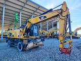 2014 Caterpillar M318D MH wheel excavator, side view