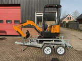 JPC HT-12 mini excavator on trailer, side view