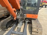 Hitachi ZX65 mini excavator, close-up of cab and boom