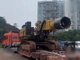 2016 Caterpillar 6015FS crawler excavator with rock saw attachment, side view