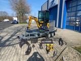 Berger Kraus BK950KS mini excavator on trailer with attachments