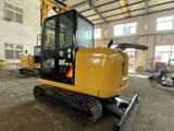 2023 Caterpillar 306E2 mini excavator, rear three-quarter view