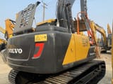 2023 Volvo EC140 crawler excavator, rear three-quarter view