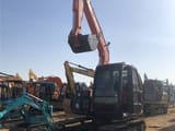 2024 Hitachi ZX70-5A mini excavator, front three-quarter view