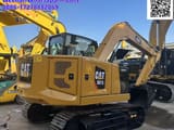 2023 Caterpillar 307.5 mini excavator, rear three-quarter view