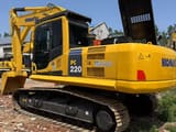 2024 Komatsu PC220 crawler excavator, rear three-quarter view