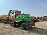 2006 New Holland MH-PLUS wheel excavator, rear three-quarter view