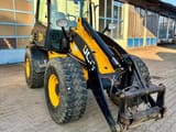 2011 JCB 409 wheel loader, front three-quarter view