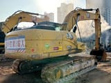2024 Caterpillar 323GX crawler excavator, rear three-quarter view