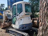 2012 Kubota U25-3EU mini excavator, rear three-quarter view