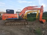 Hitachi Zaxis 210 crawler excavator side view