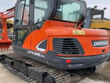 2022 Doosan DX55-9C mini excavator, rear three-quarter view