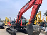 2023 Doosan DX225 crawler excavator, front three-quarter view