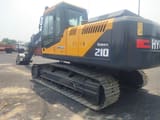 2025 Hyundai Robex 210 crawler excavator, rear three-quarter view