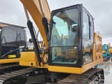 Caterpillar 320GC crawler excavator, side view of cab and boom