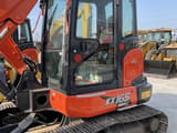 Kubota KX165-5 mini excavator, side view of the cab