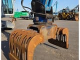 2016 Fuchs MHL331 material handler grapple attachment close-up