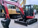 2023 Kubota KX057-4 mini excavator, front three-quarter view