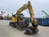 2022 Komatsu PC138US-11 crawler excavator, front three-quarter view