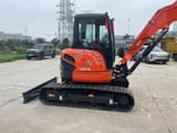 2024 Kubota U55-4 mini excavator, side profile view