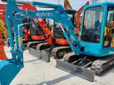 2023 Kubota U25 mini excavator, front three-quarter view