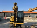 2024 Caterpillar 305.5E2 mini excavator, front view