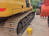 2025 Caterpillar 323 crawler excavator side view of tracks