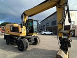 2016 Caterpillar M318F wheel excavator, front three-quarter view