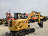 2023 Caterpillar 305.5E mini excavator, rear three-quarter view