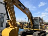 2022 Caterpillar 323D2L crawler excavator, front three-quarter view