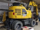 2023 Komatsu PW138MR wheel excavator, rear three-quarter view