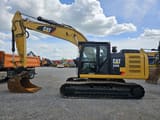 2014 Caterpillar 320EL crawler excavator side view