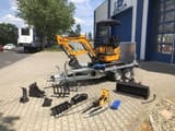 Berger Kraus BK1700JS mini excavator on trailer with attachments