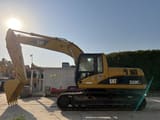 Escavatore cingolato Caterpillar 320CL del 2010, vista laterale