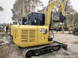 2024 Caterpillar 306 mini excavator, rear three-quarter view