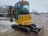 2024 Caterpillar 303-07CR crawler excavator, rear three-quarter view