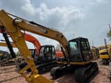2024 Caterpillar 312 crawler excavator, front three-quarter view