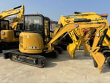2023 Caterpillar 303.5E mini excavator, rear three-quarter view