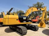 2015 Caterpillar 323DL crawler excavator, rear three-quarter view