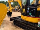 2024 Caterpillar 304 CR mini excavator, side view
