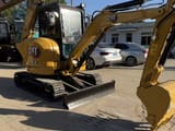 2021 Caterpillar 303.5E mini excavator, front three-quarter view