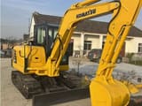 2024 Komatsu PC56-7 mini excavator, rear three-quarter view