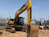 2023 Caterpillar 313D2 crawler excavator, front three-quarter view
