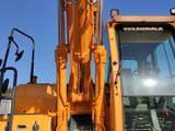 2014 Hyundai R140W-9 wheel excavator, close-up of cab and boom