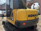 Komatsu PC56 mini excavator, rear three-quarter view