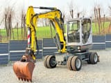 2011 Wacker Neuson 6503 wheel excavator, front three-quarter view