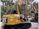 2025 Caterpillar 312D crawler excavator, rear three-quarter view