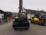 Caterpillar 306CR-07A mini excavator, front view with boom raised
