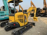 2023 Komatsu PC30MR-3 mini excavator, rear three-quarter view