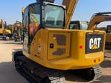 2024 Caterpillar 307.5 mini excavator, rear three-quarter view